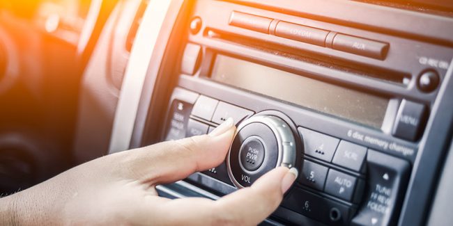 gand touchign the radio dial